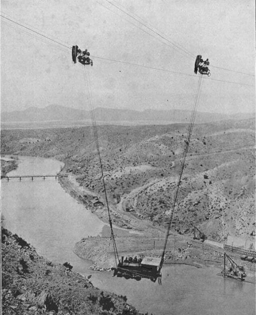In 1915, a steam locomotive in New Mexico, USA, is pulled across the Rio Grande River by a cable.