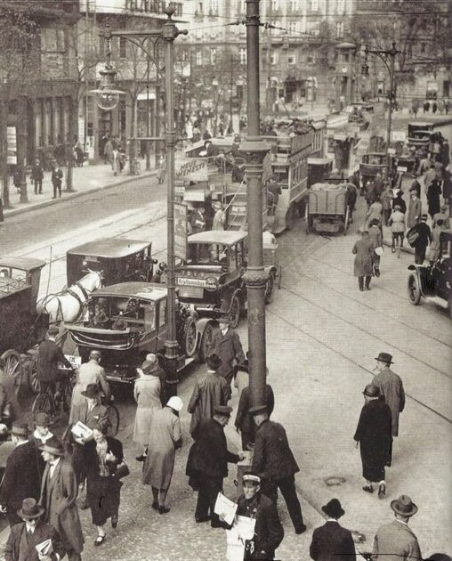 A bustling street at rush hour in Berlin, Germany, 1927.