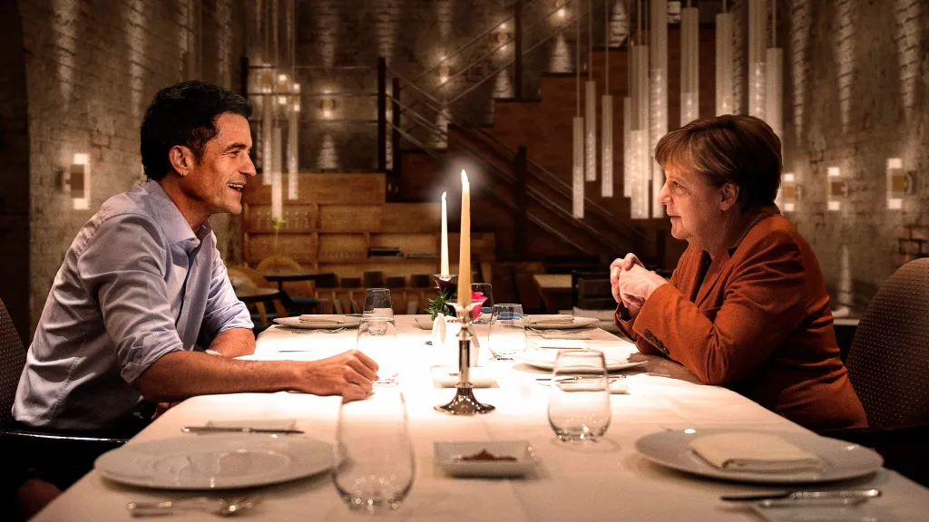 Orlando Bloom and Angela Merkel dining together in Berlin, sparking gossip after a cozy meal, per celebrity reports.