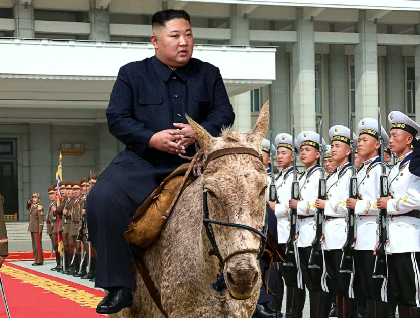 Kim Jong-Un on slow-moving armored mule at summit, per satirical September 2025 news.